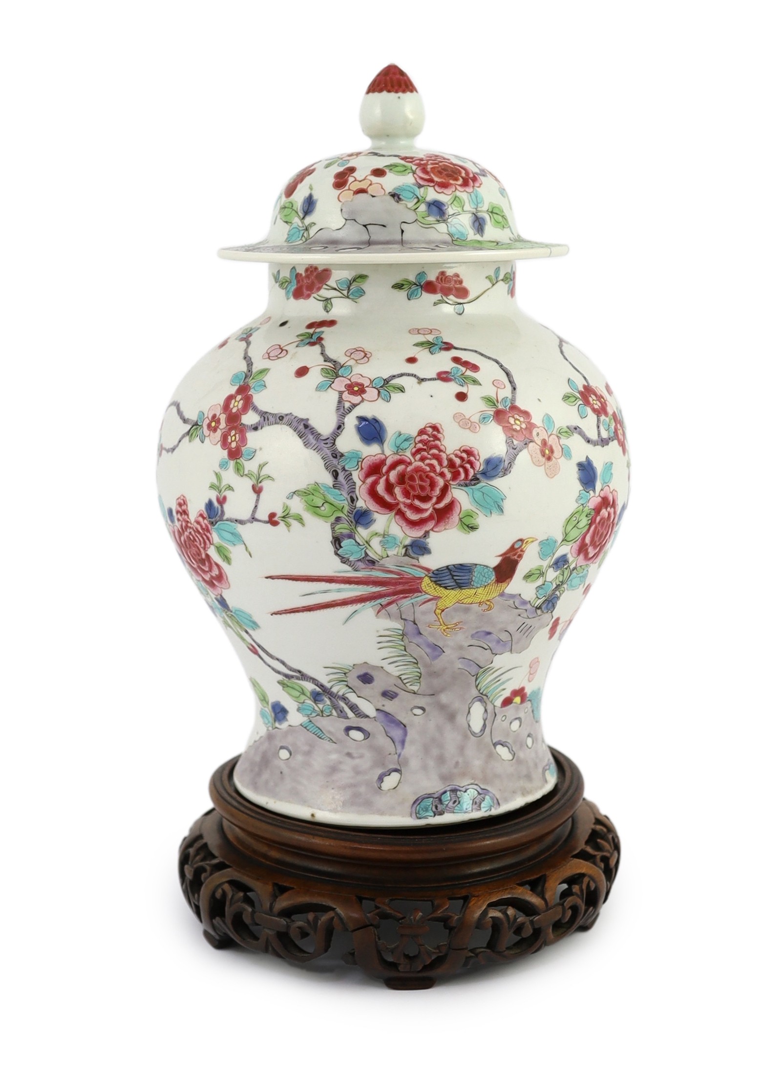 A Chinese famille rose fencai 'pheasant' vase and cover, 19th century, Jiaqing-Daoguang period, 28cm high, small faults to cover, wood stand